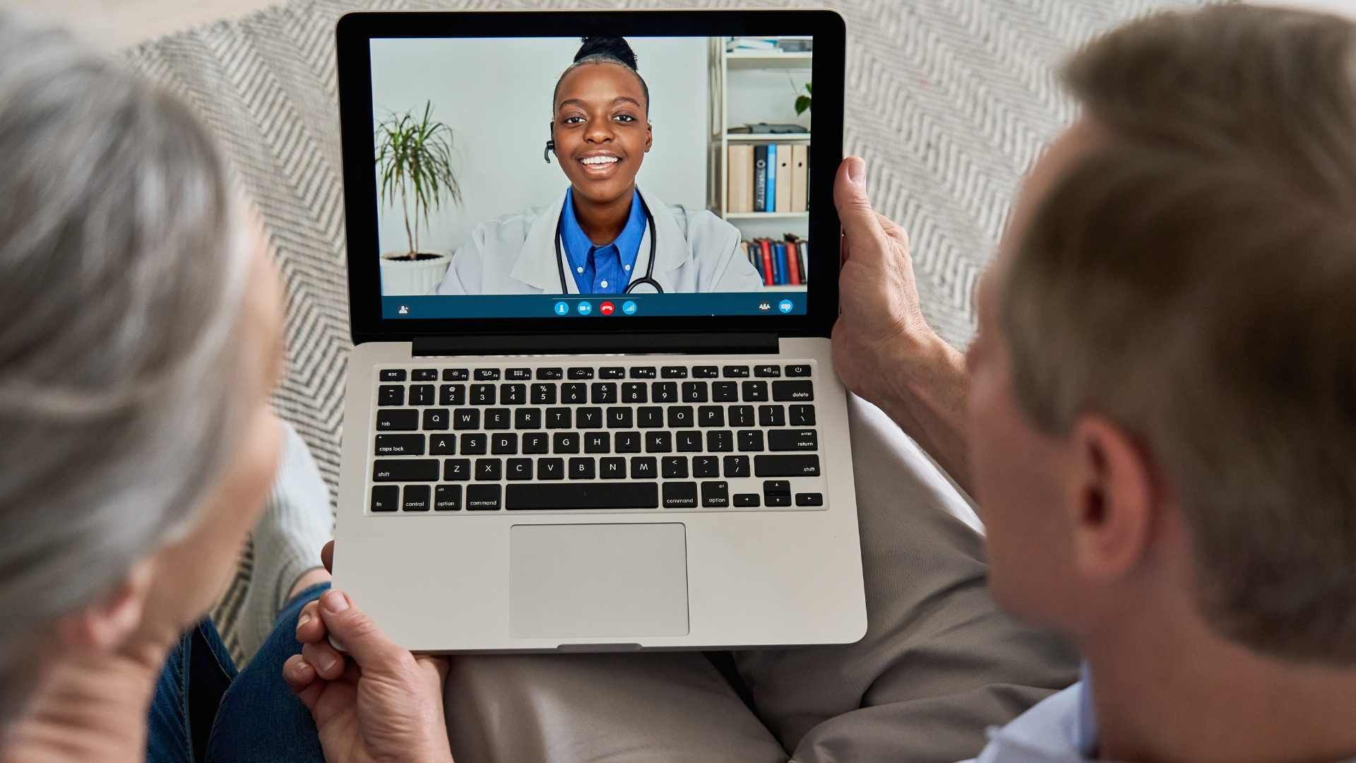 Couple doing televisit with a dr