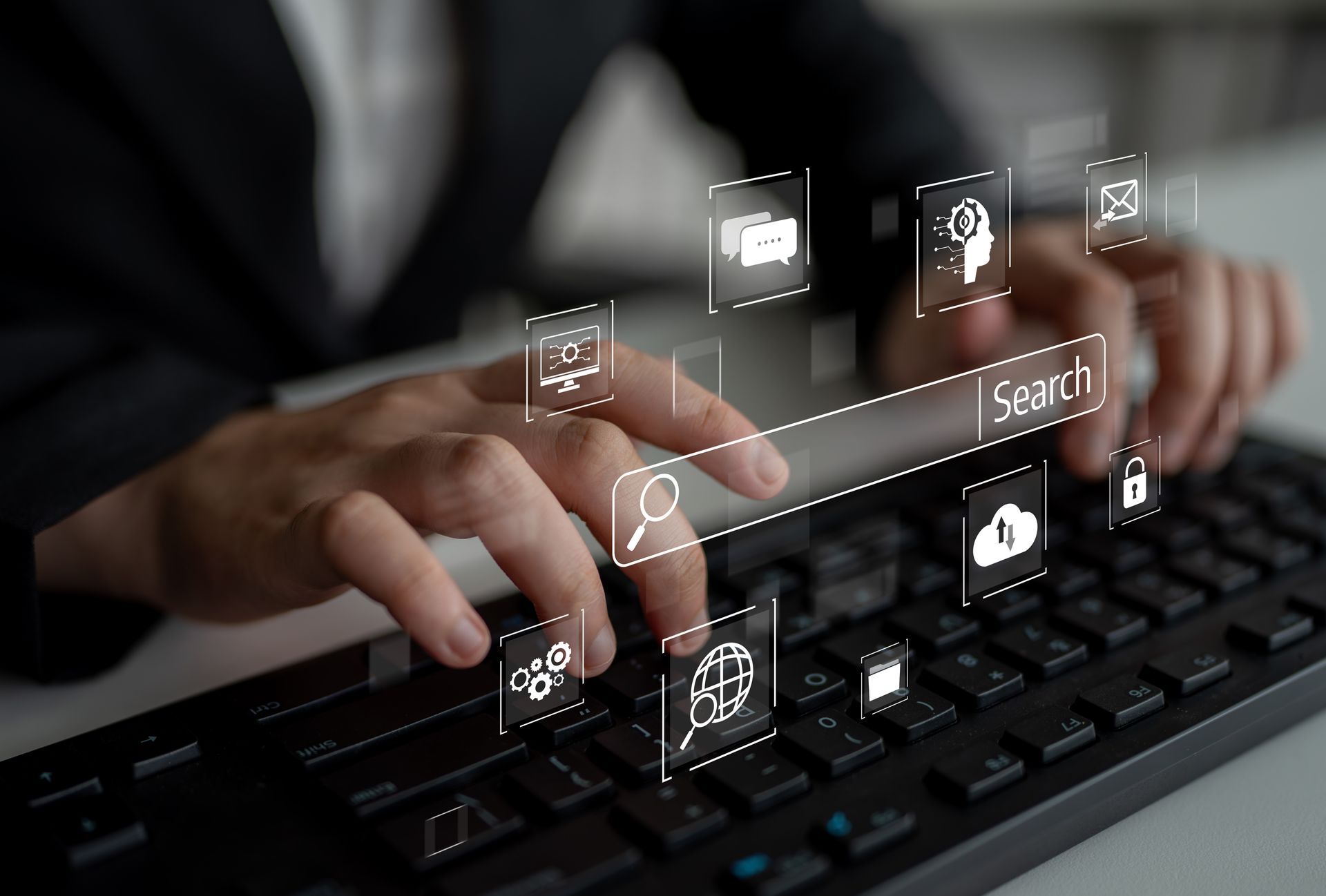 Hands typing on a black keyboard with a search bar and digital icons overlaid.