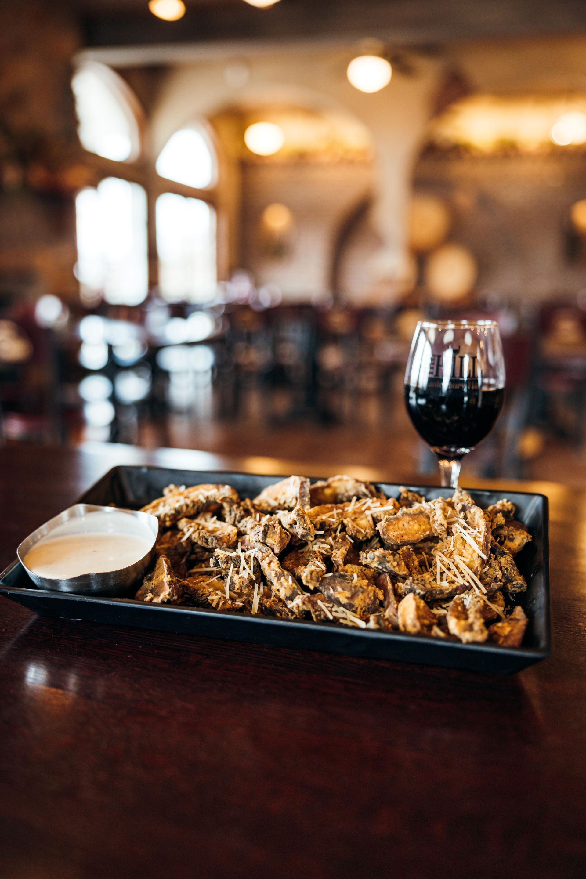 Enjoy a Glass of Wine & Our Delicious Portobello Fries at Canterbury Hill Winery & Restaurant.