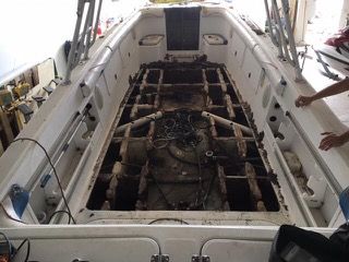 Boat interior with exposed framework; visible wires and compartments.