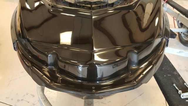 Black, glossy jet ski front section.