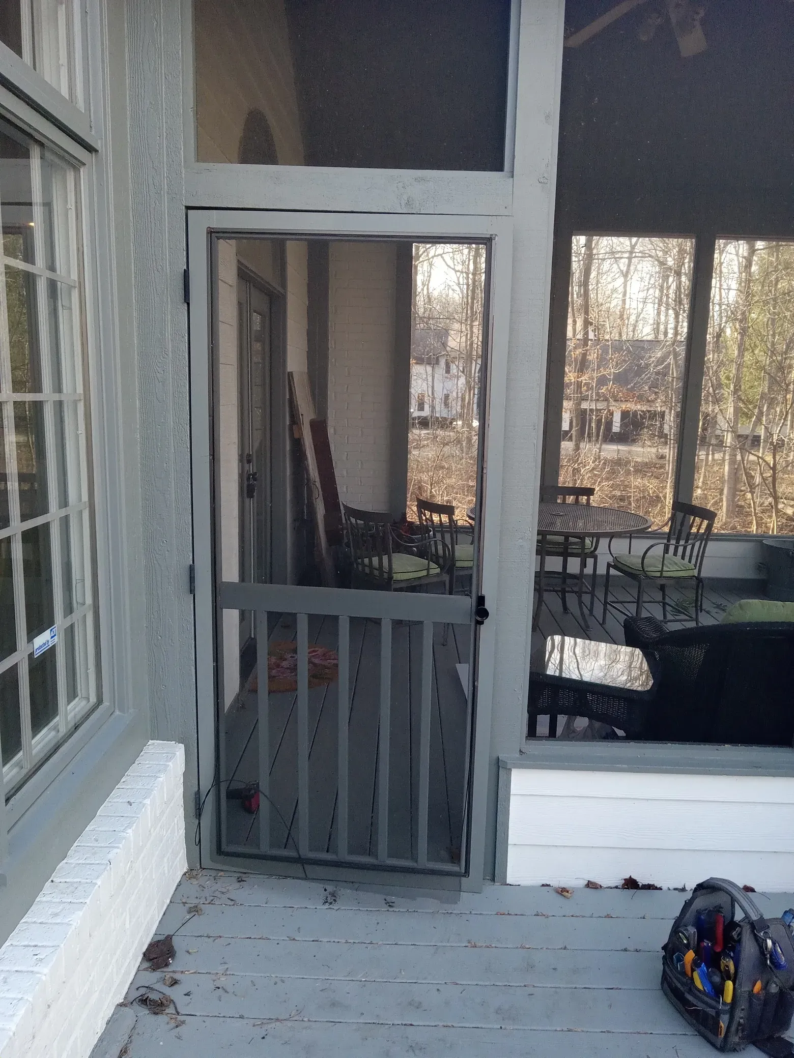 Completed screen door installation with fresh paint for home repair and handyman service