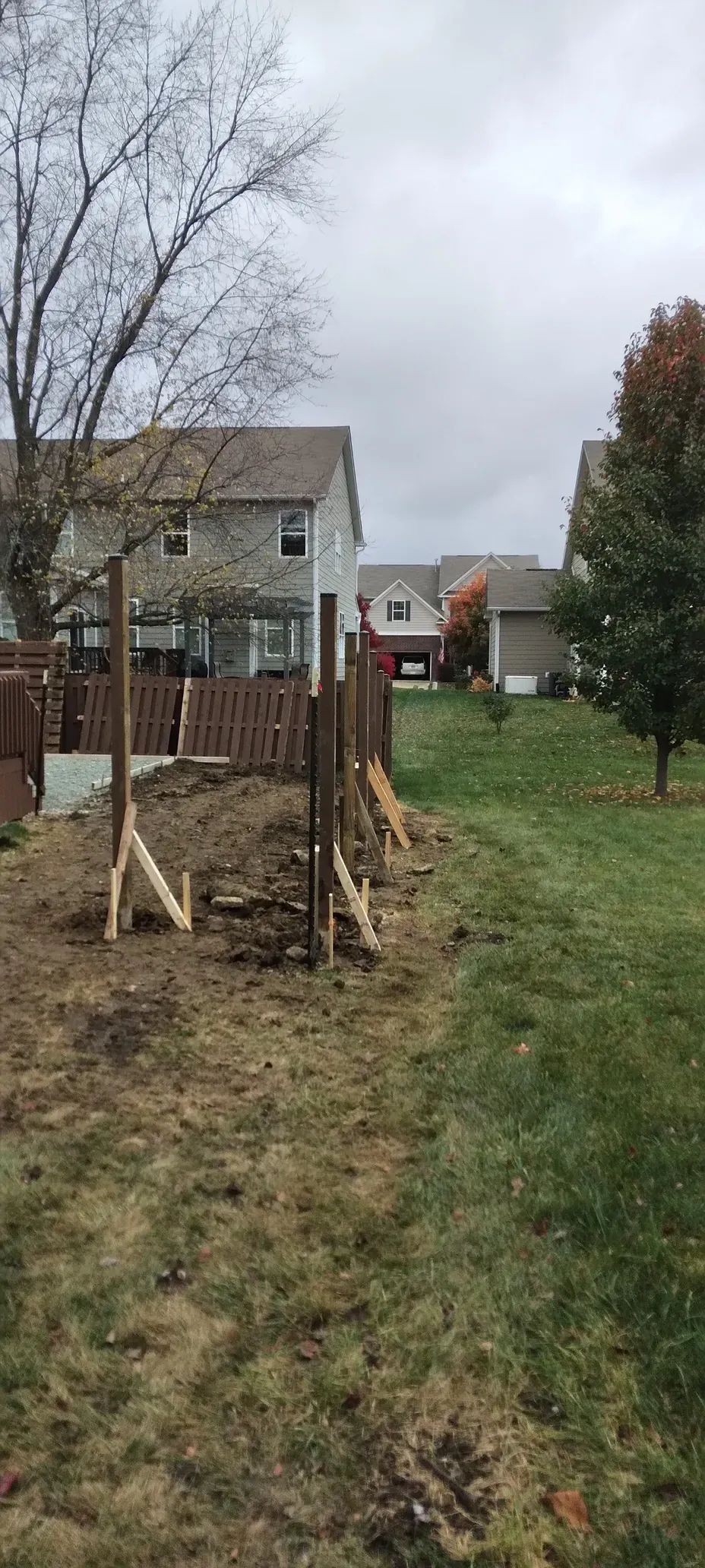 Fence installation project with posts set for residential handyman repair services