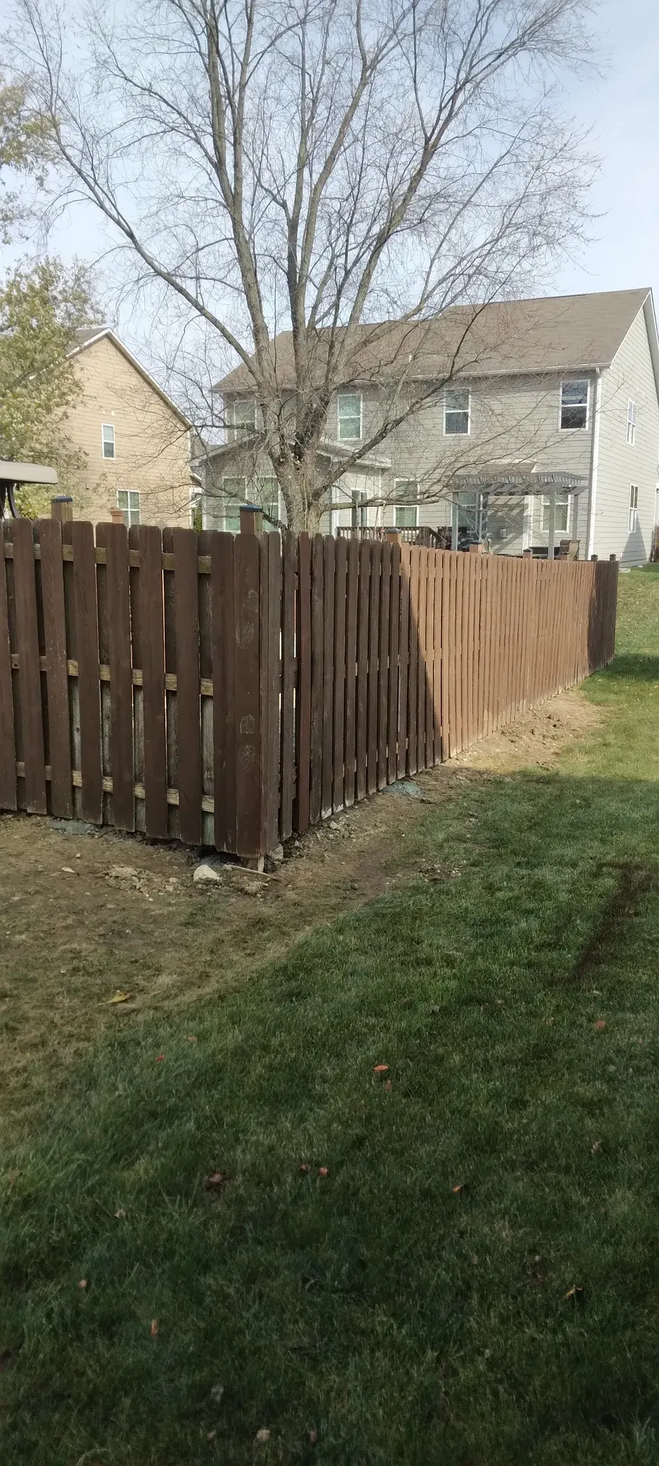 New wooden fence installation for residential property by handyman repair services