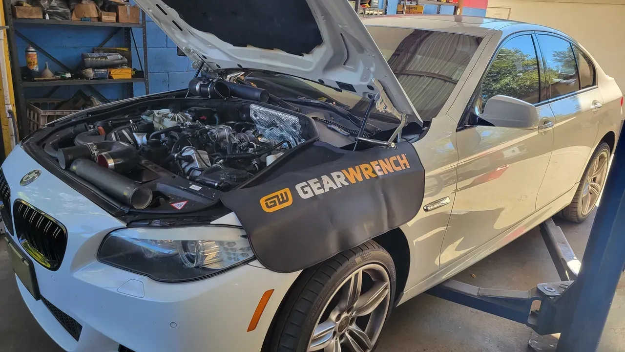 A vehicle with an opened hood | Your Mechanic 813