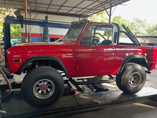 Red vehicle at our repair shop | Your Mechanic 813