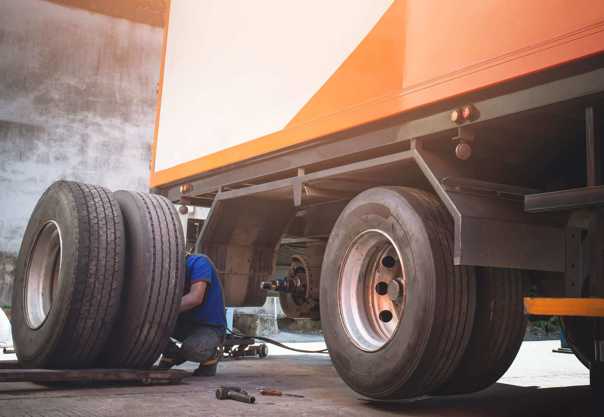 Mechanic Changing Truck Tires — Commerce City, CO — Bigfoot Diesel Parts