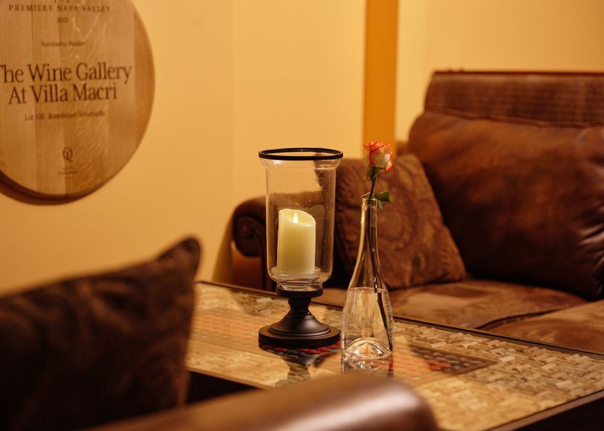 A living room with a sign that says the wine gallery at villa macro