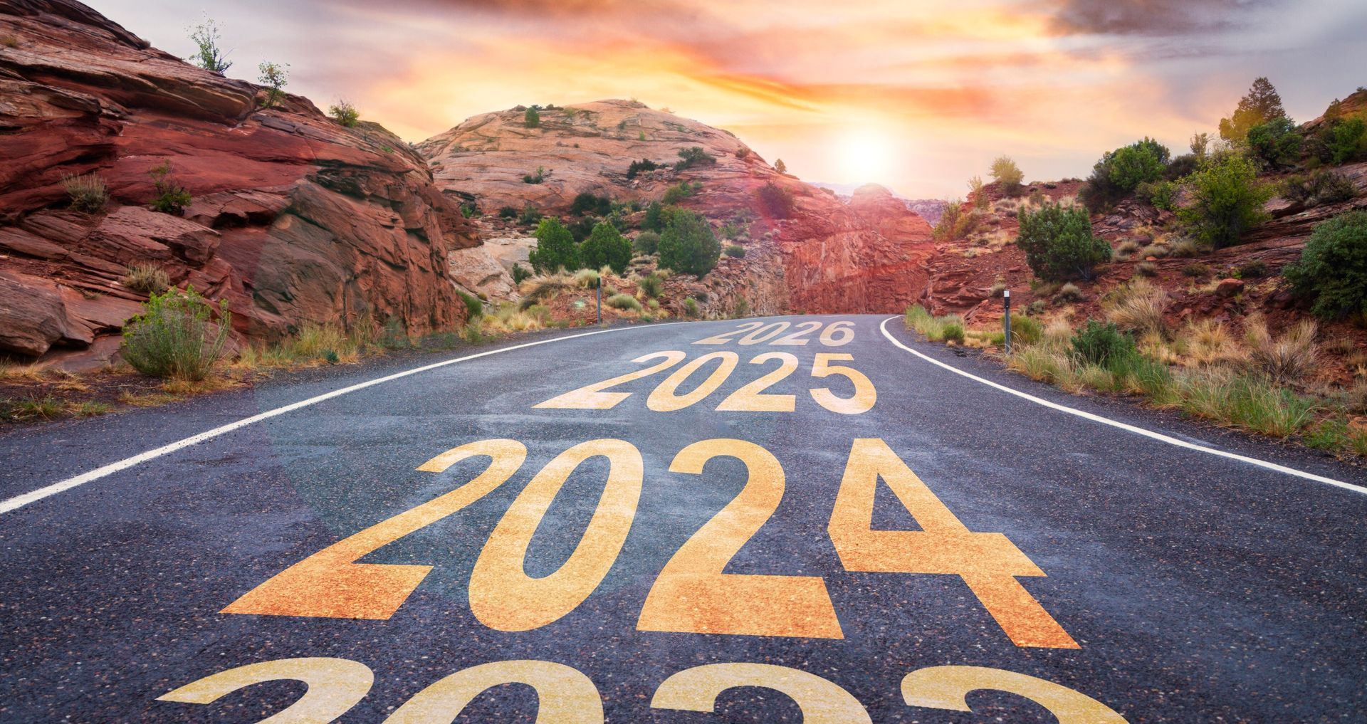 The year 2024 is painted on the side of a road.