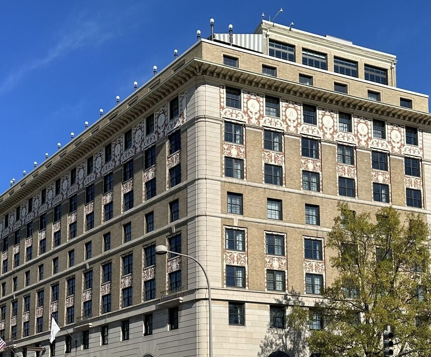 A large building with a lot of windows on a sunny day