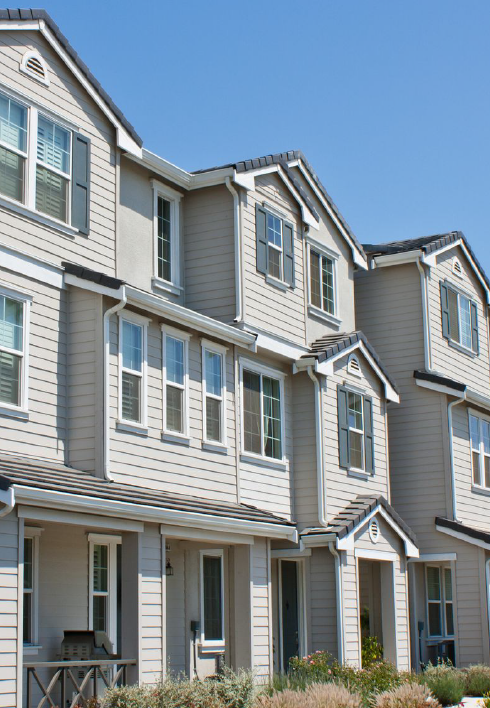 a row of apartment buildings.