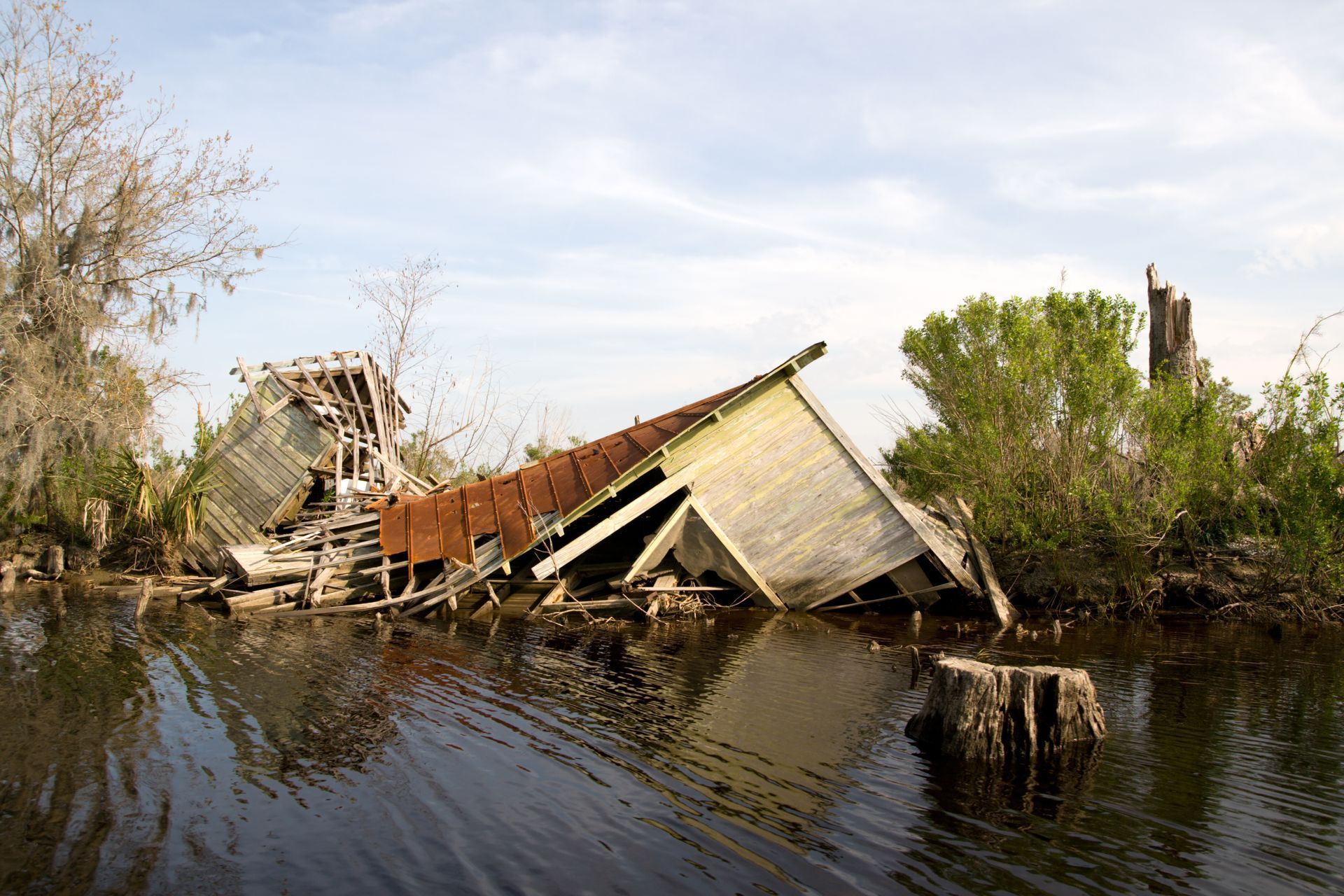 A Louisiana home destroyed and partially submerged following Hurricane Katrina