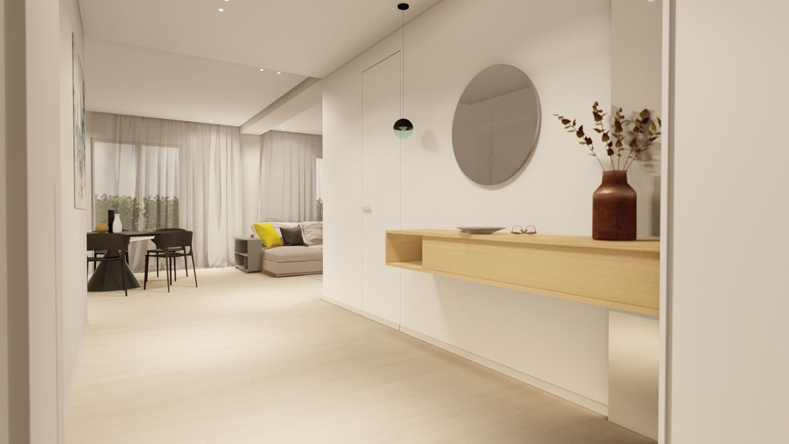 Un corridoio che conduce a un soggiorno con un divano e un tavolo.