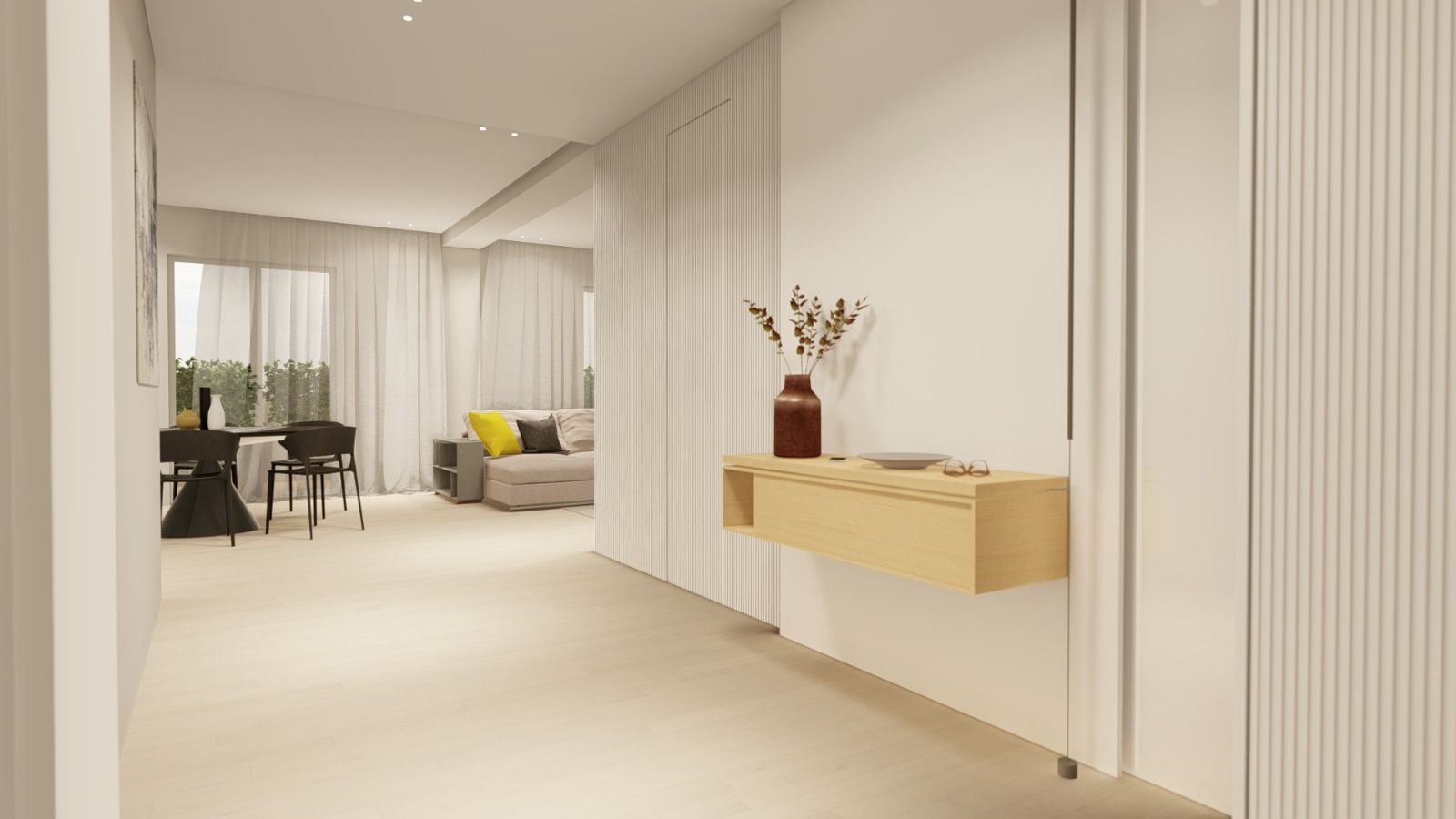 Un corridoio che conduce a un soggiorno con un divano e un tavolo.