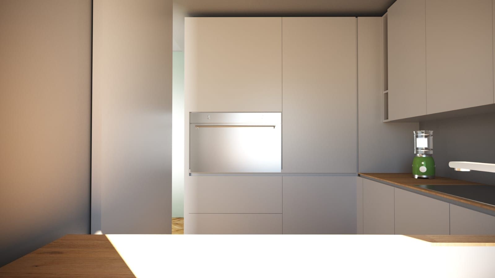 Una cucina con mobili bianchi e un forno in acciaio inox