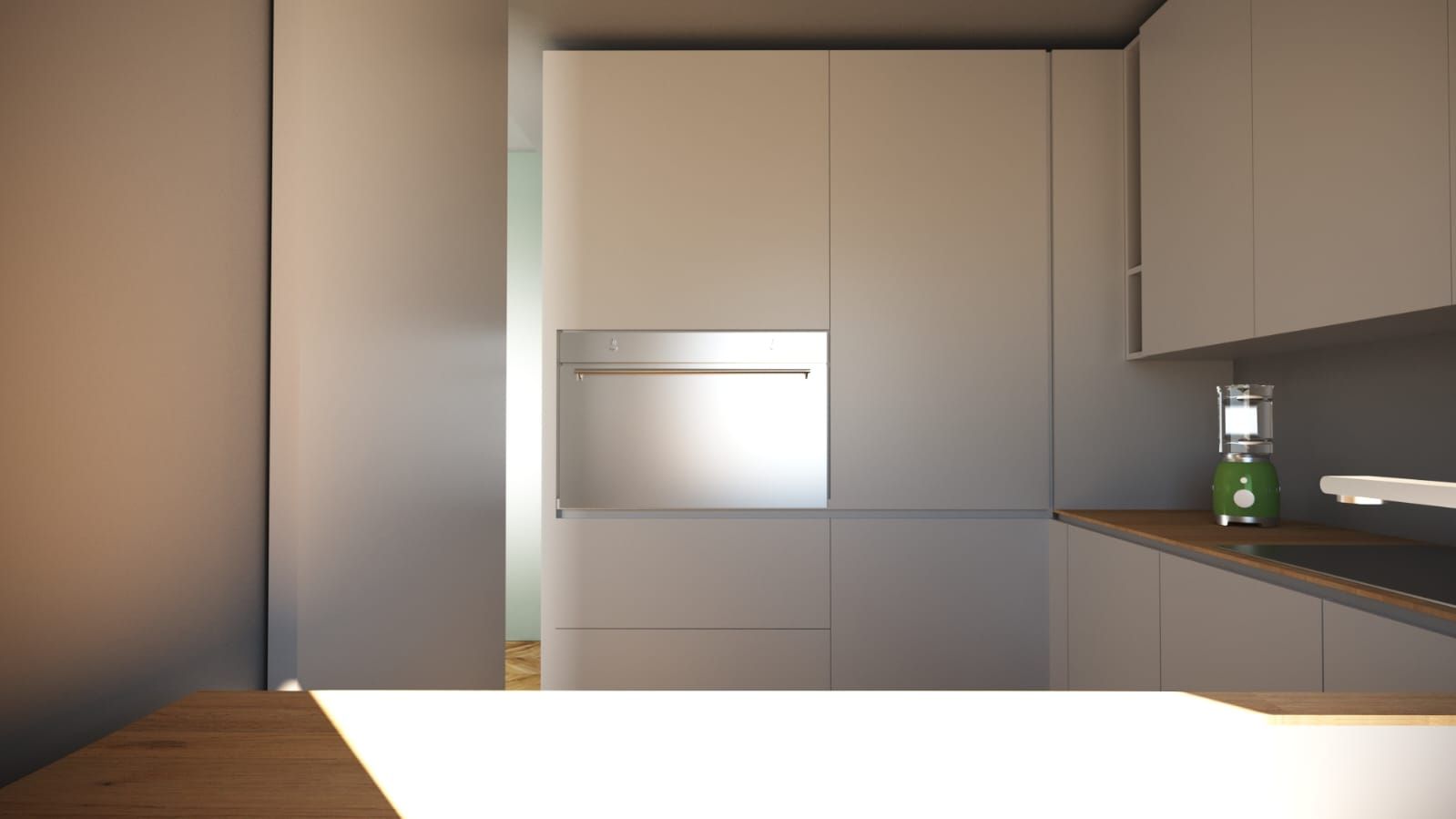 Una cucina con mobili bianchi e un forno in acciaio inox