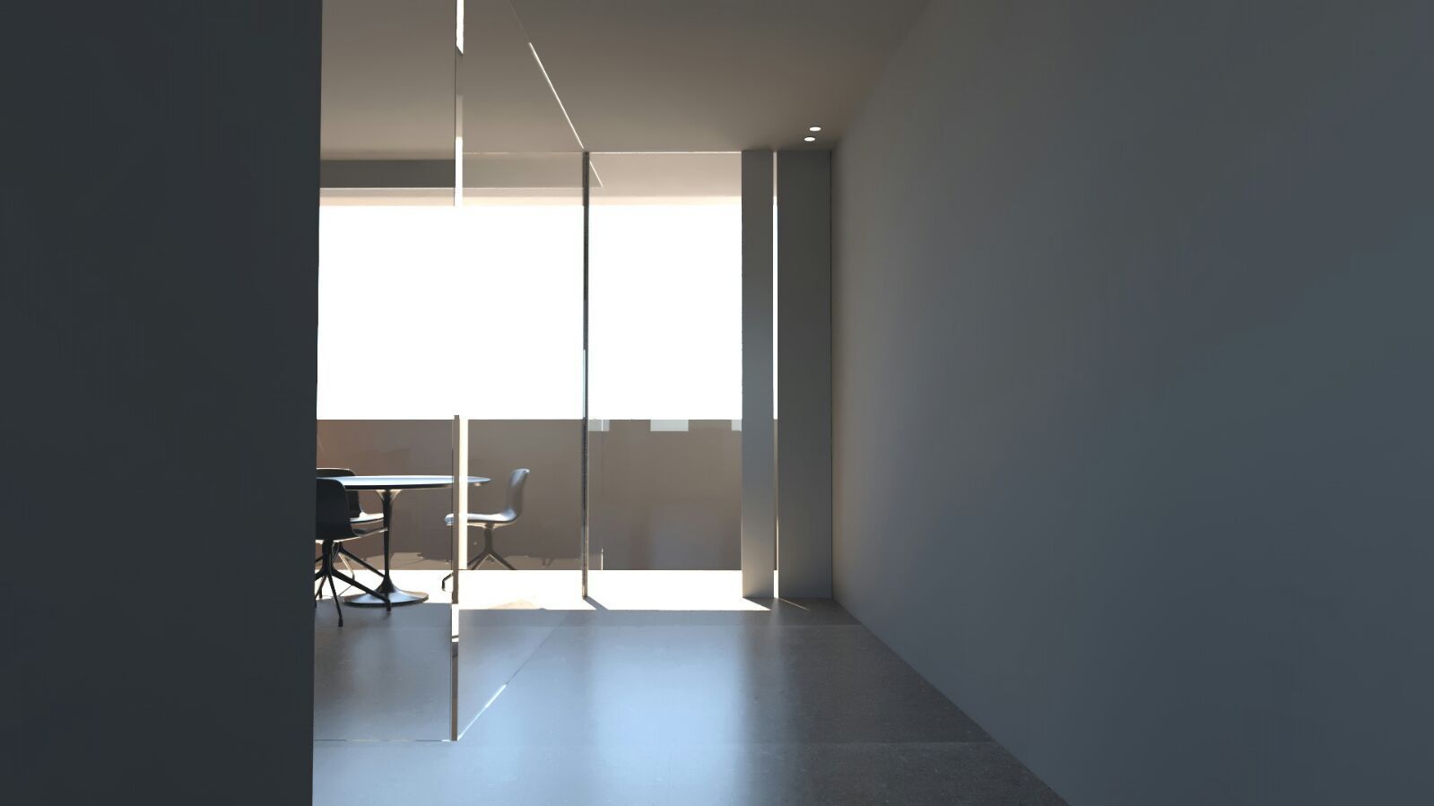 Una stanza vuota con un tavolo e delle sedie