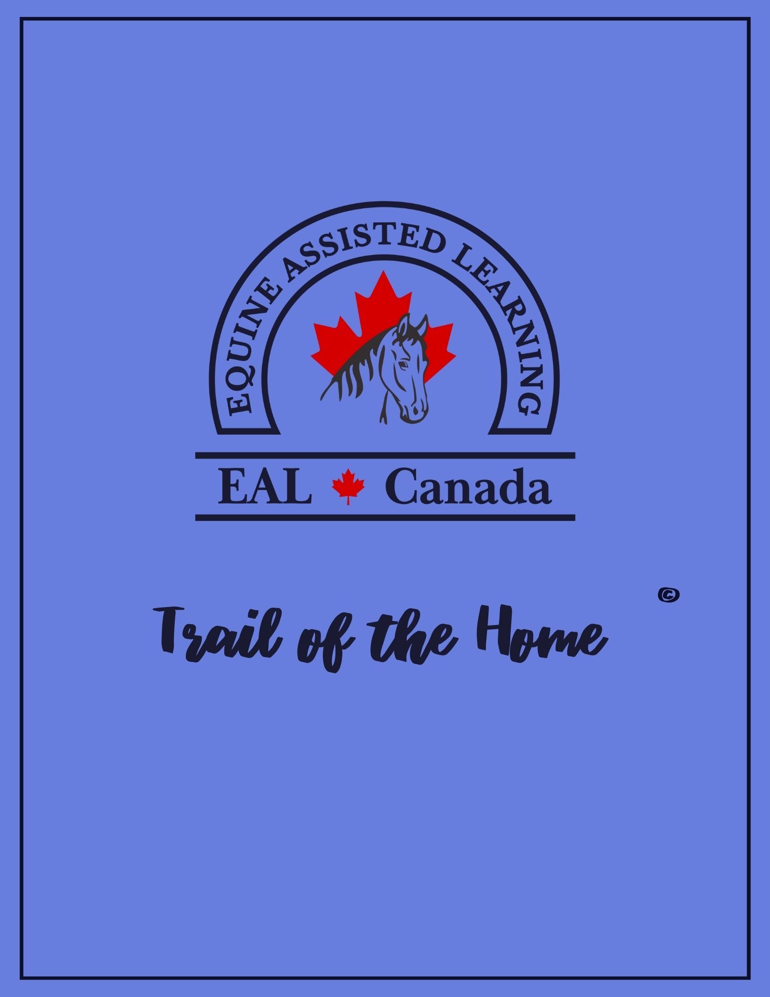 A person is holding a blue book on a table next to a cup of coffee.