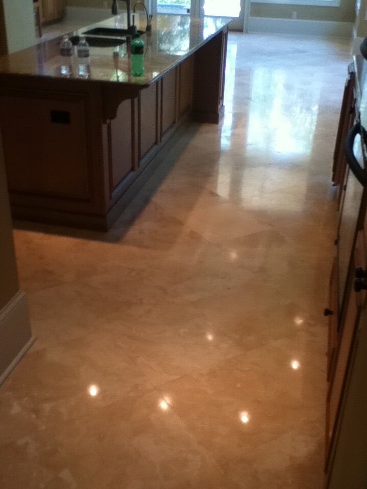 Brown Kitchen With Shiny, Reflective Floor, Wood Island, and Cabinets — Stone Restore by Hoover and Lane in Lowcountry, South Carolina