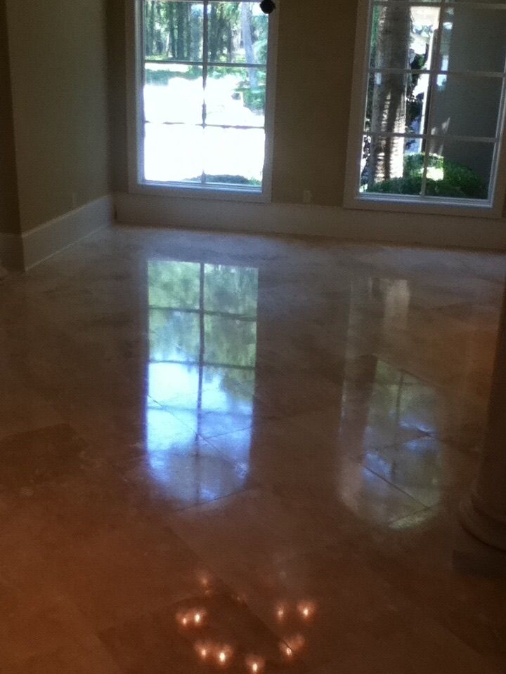 Glossy, Light-colored Floor Reflecting Sunlight From Two Windows — Stone Restore by Hoover and Lane in Lowcountry, South Carolina