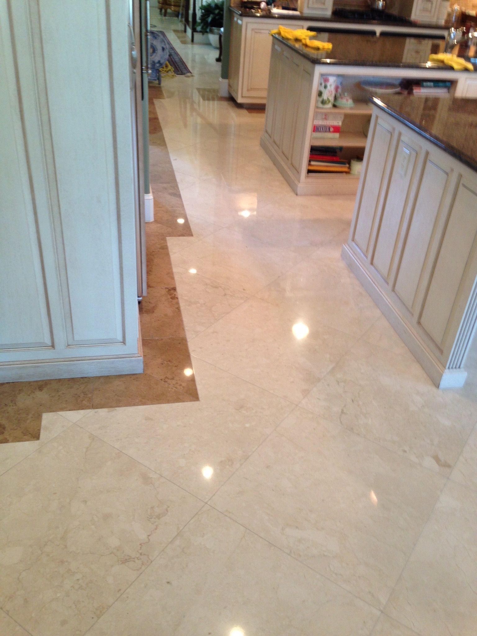 Polished Brown Marble Floor Reflecting Light and the Outside — Stone Restore by Hoover and Lane in Lowcountry, South Carolina