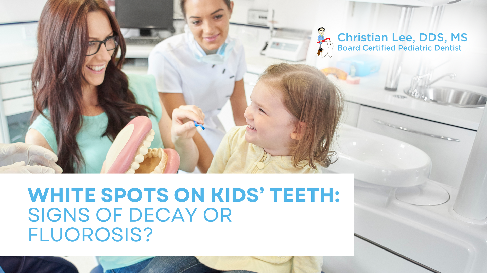 A woman is brushing a child 's teeth in a dental office.