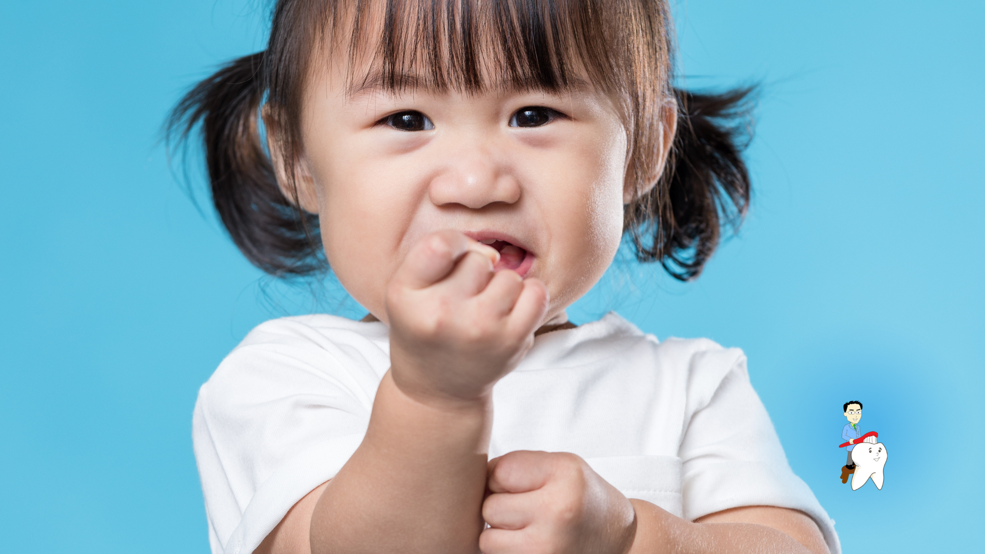 A little girl is biting her nails on a blue background.