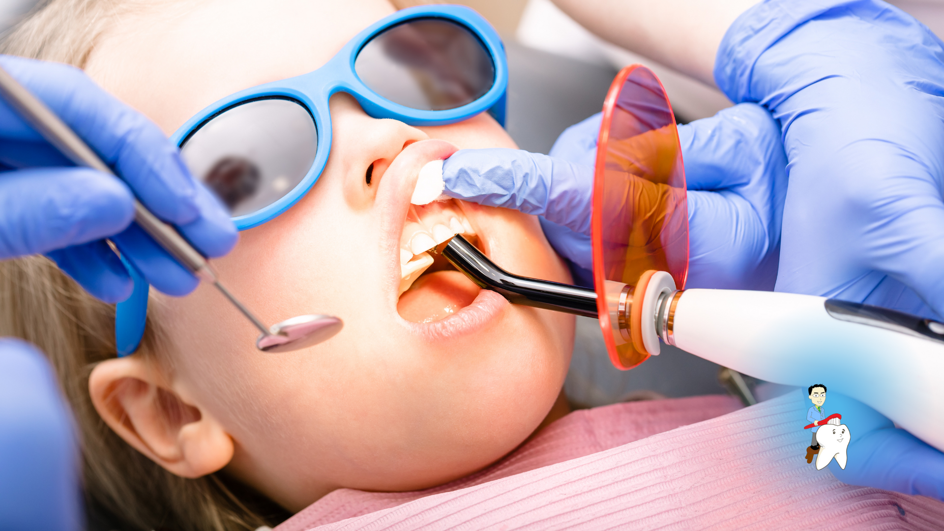 A little girl is getting her teeth examined by a dentist.