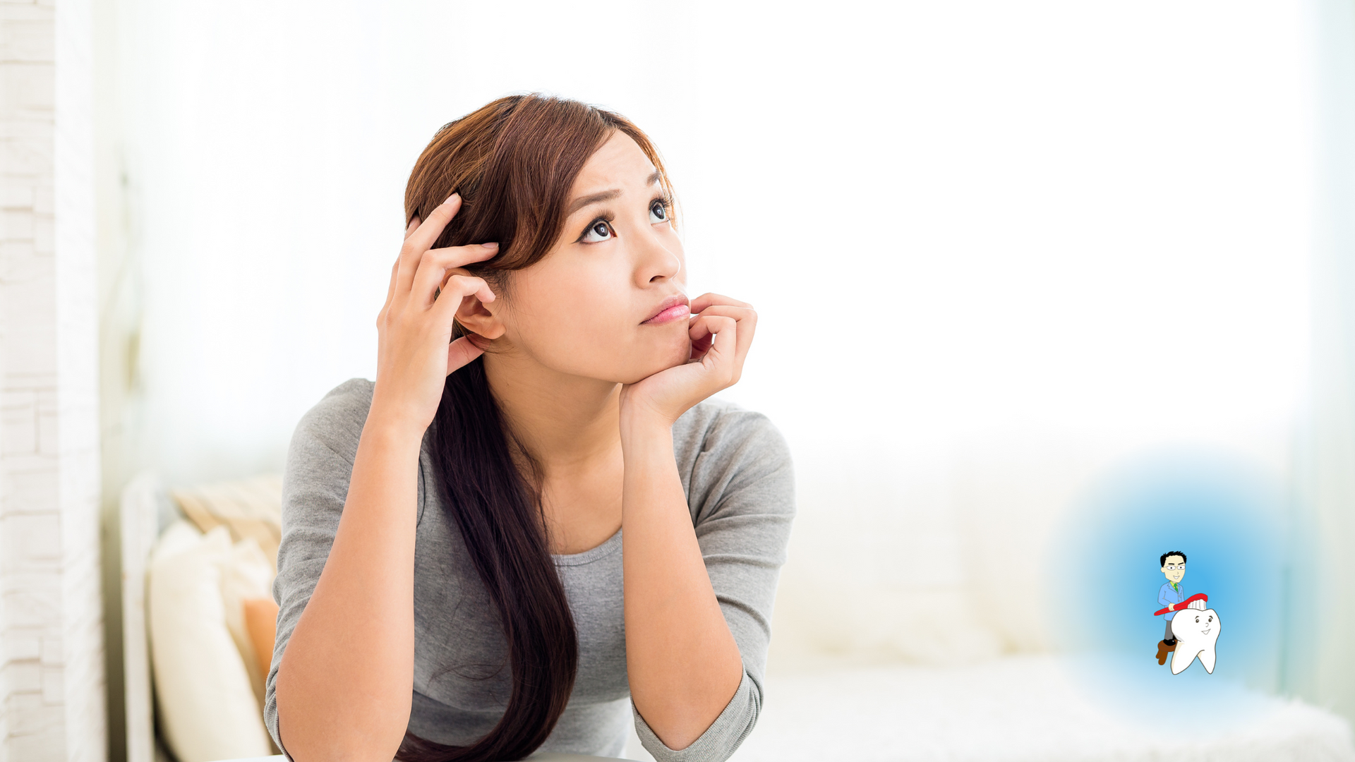 A woman is sitting on a couch looking up at the sky.