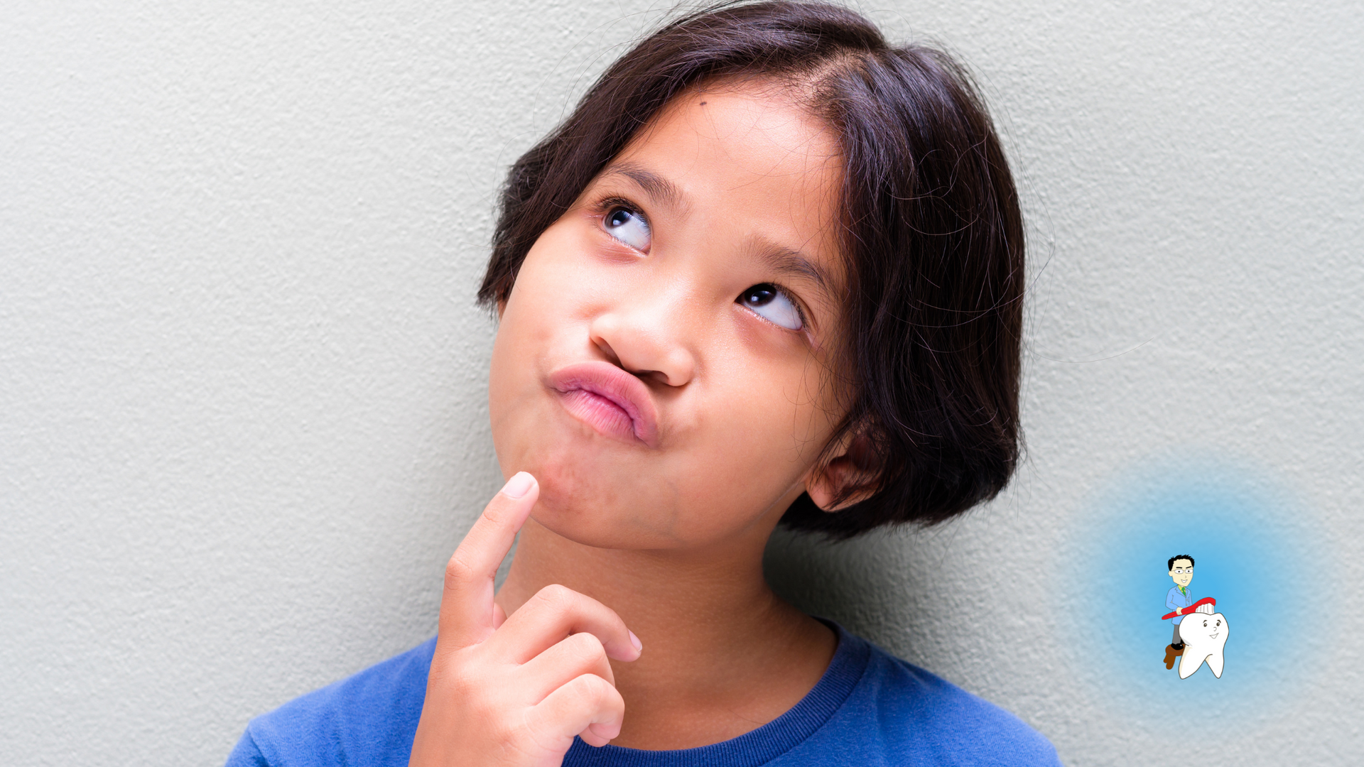 A young girl is making a funny face with her finger on her chin.