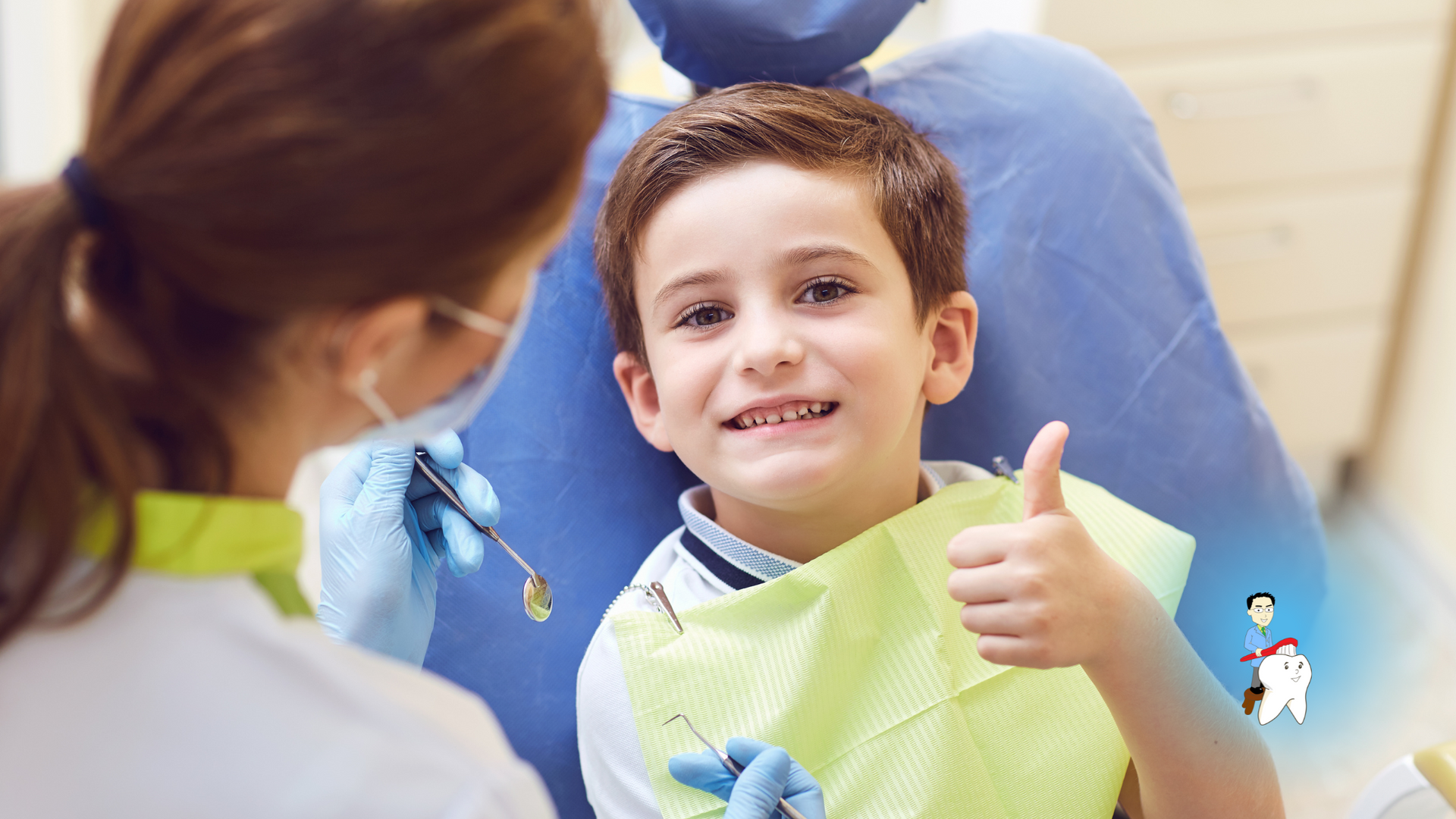 A young boy is giving a thumbs up while sitting in a dental chair.