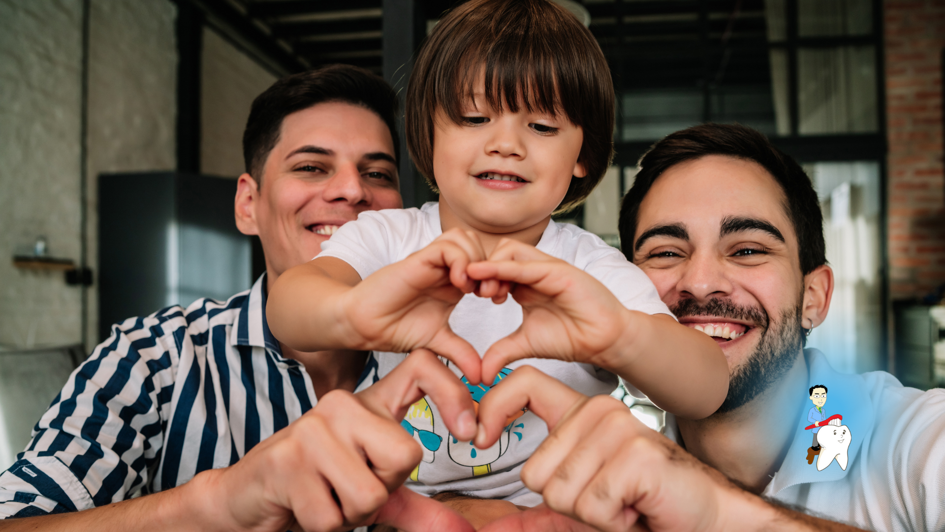 Two men and a little boy are making a heart shape with their hands.