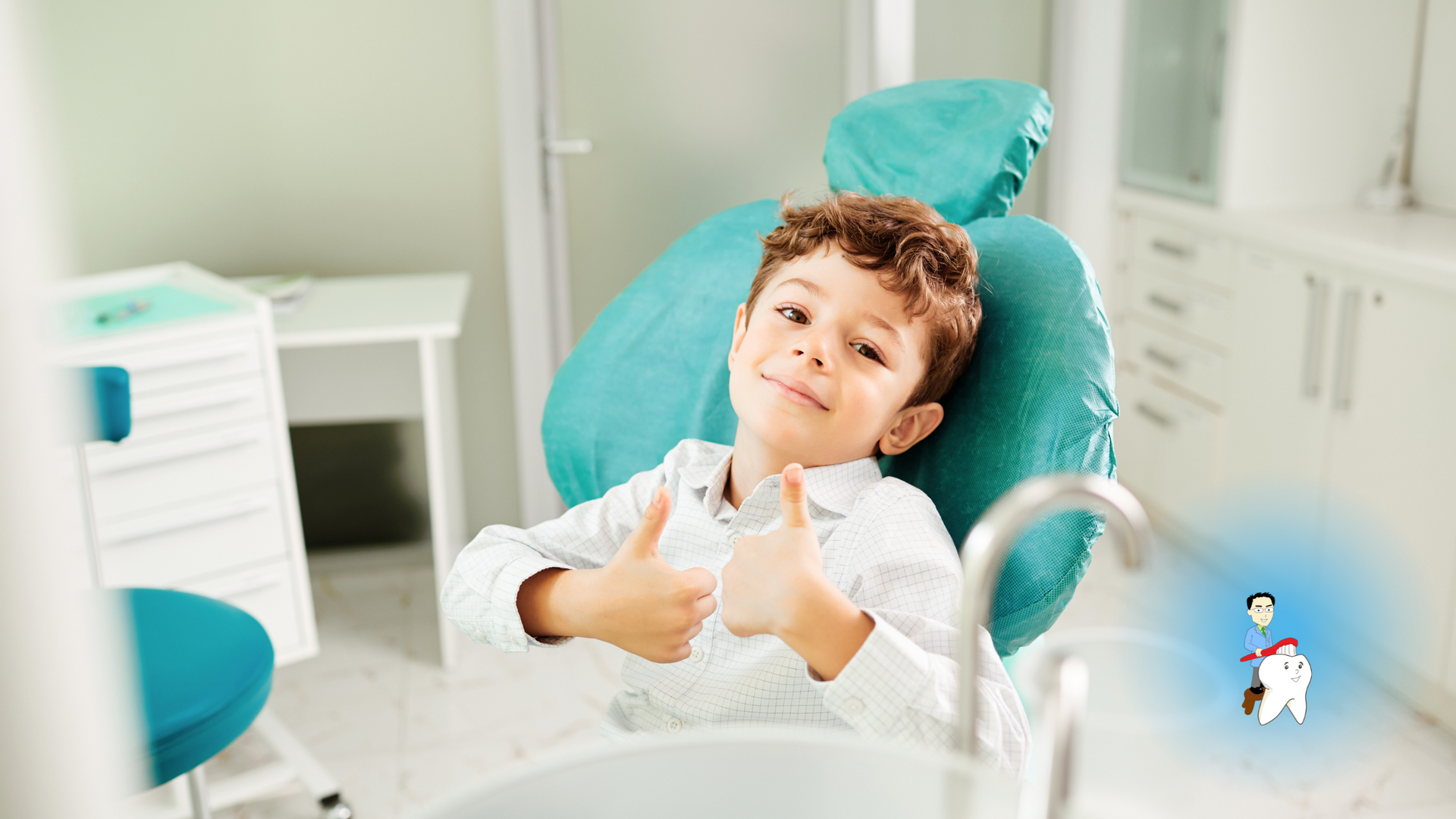 A young boy is sitting in a dental chair giving a thumbs up.