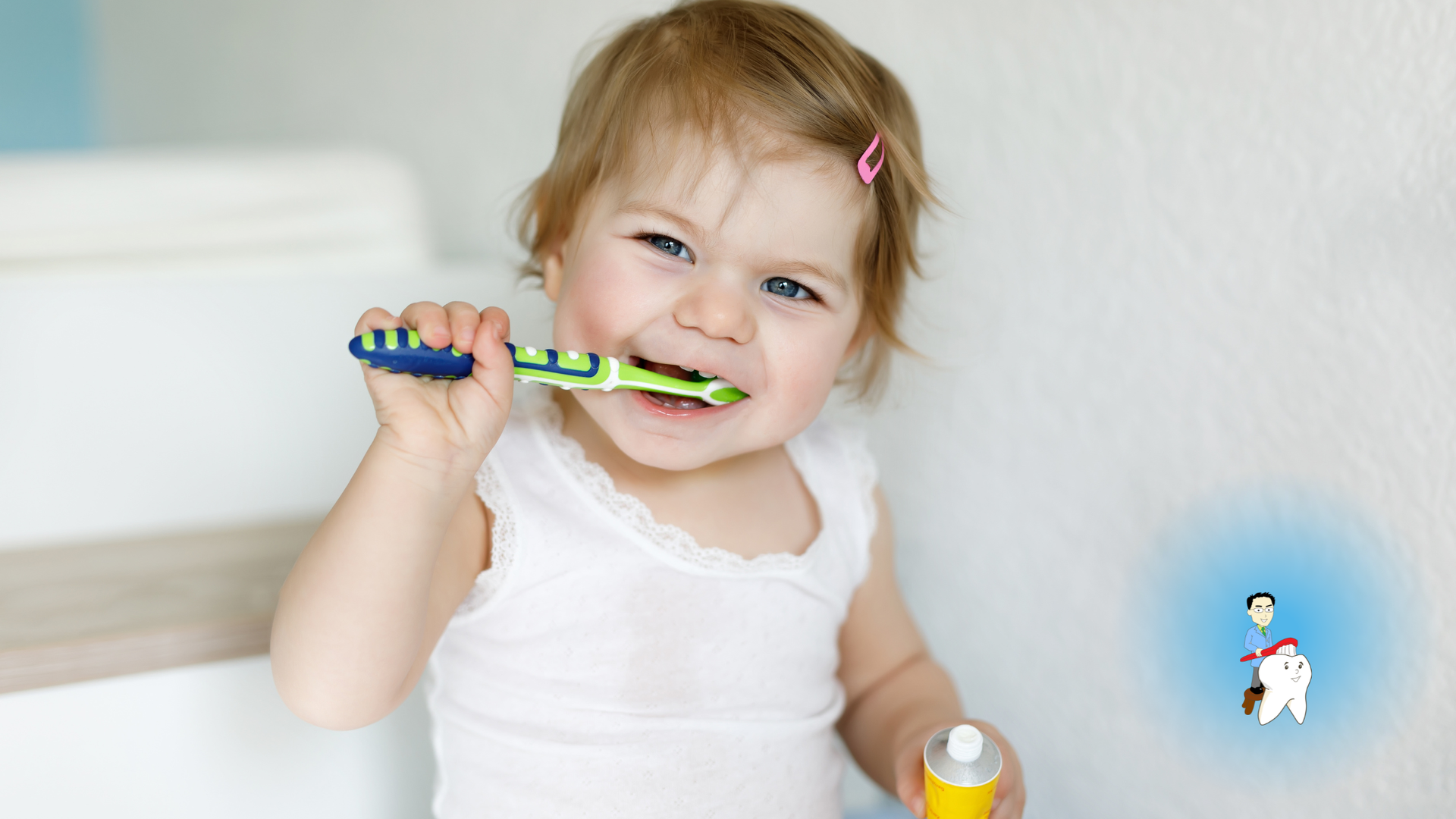 Young child brushing teeth with toothbrush in front of a white wall.
