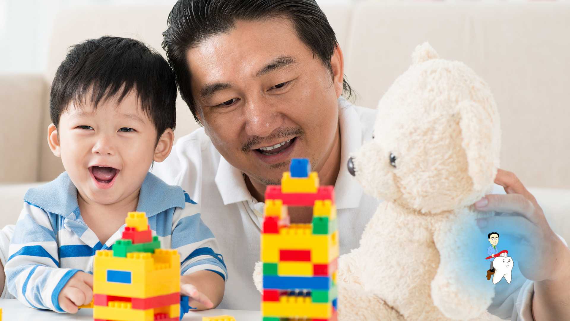 A man and a child are playing with lego blocks and a teddy bear.