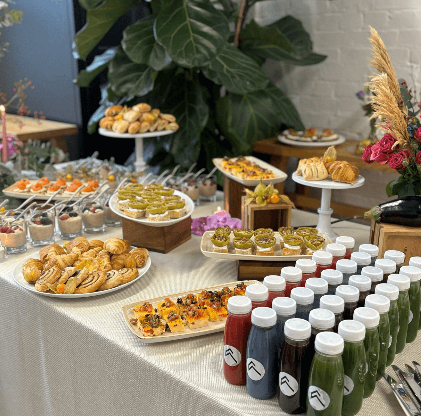 A table with a lot of food and juices on it