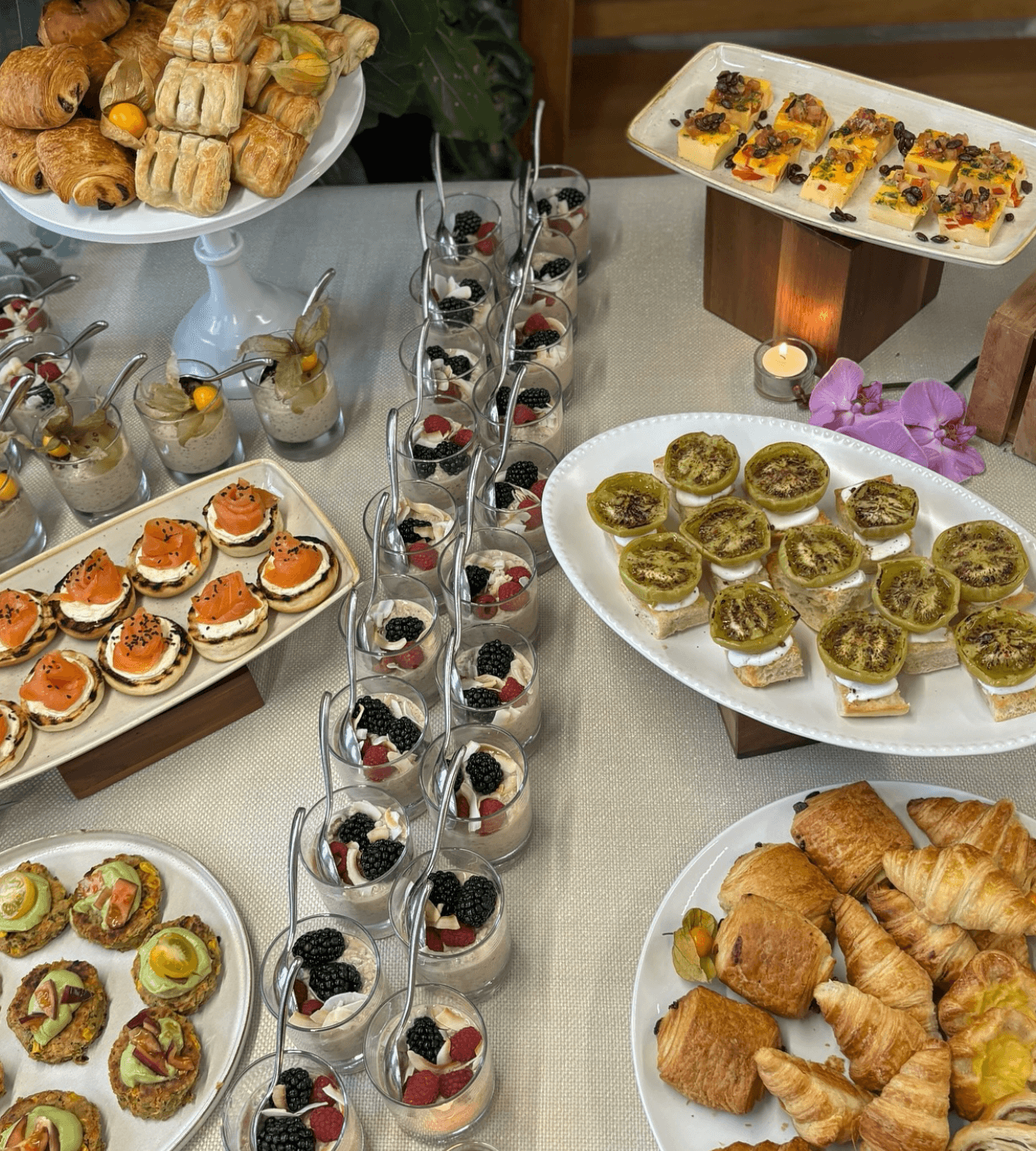 A table topped with a variety of desserts and pastries.