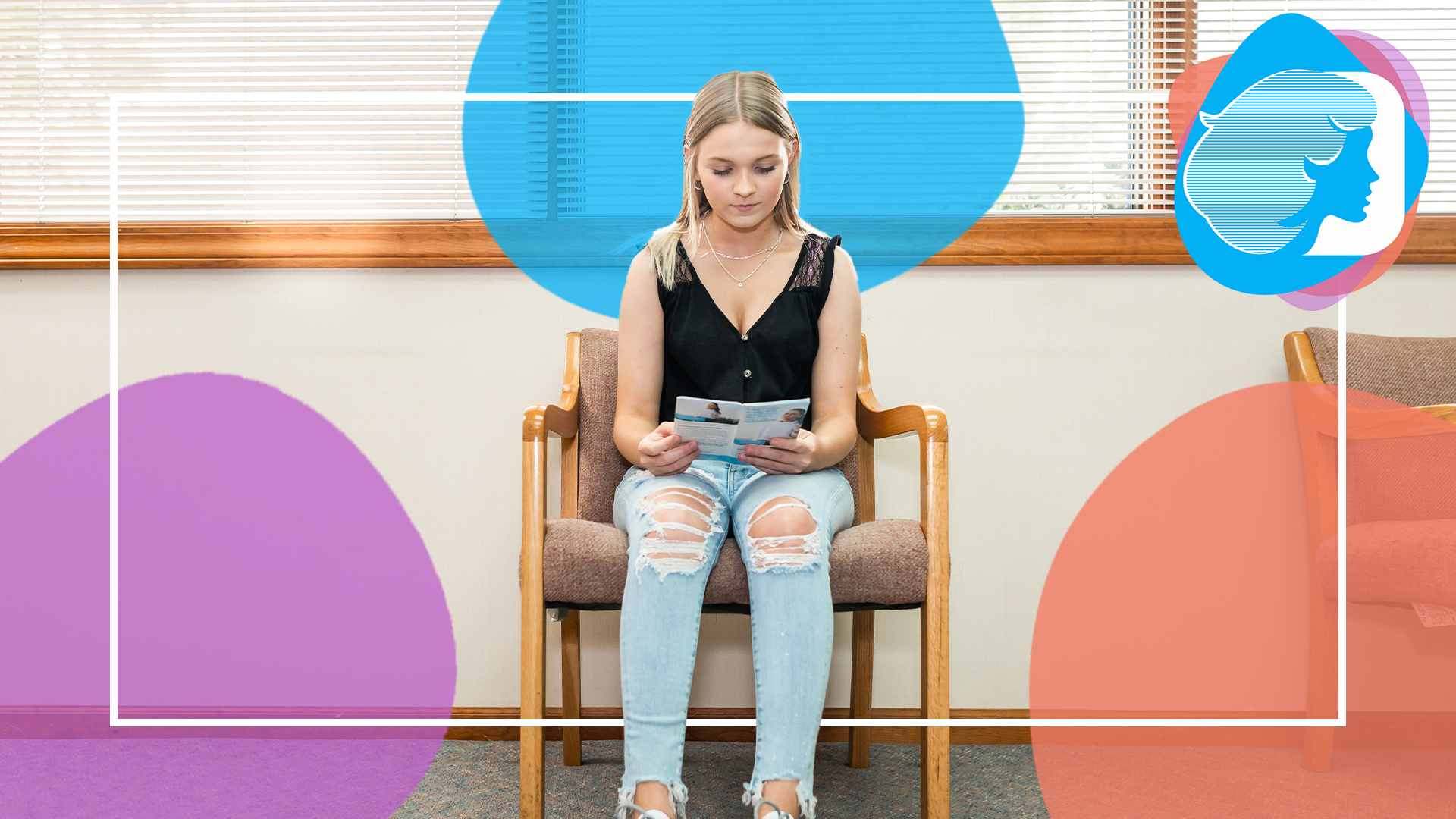 Young woman reading informational brochure in doctor's office.