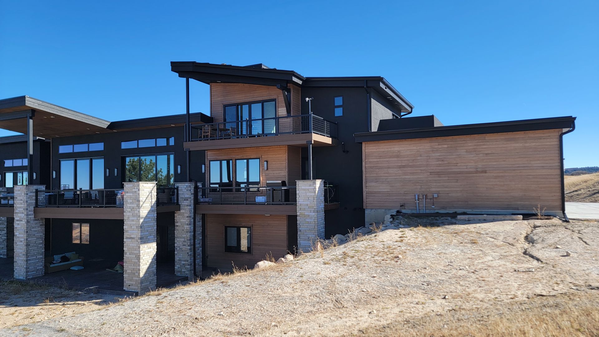 A large house with a lot of windows is being built.