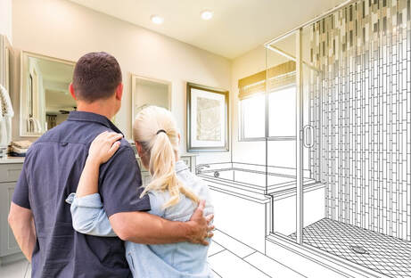 Handyman Service bathroom remodeling with a picture of a couple looking at a renovated bathroom. The man is wearing a blue shirt and the women is wearing a light blue shirt with blonde hair hugging each other. Half the picture is in the form of a black and white drawing of the envisioned shower and bathtub.
