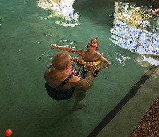 Child With Special Needs Receiving Swimming Lessons - Hydrotherapy in Croudance Bay, NSW