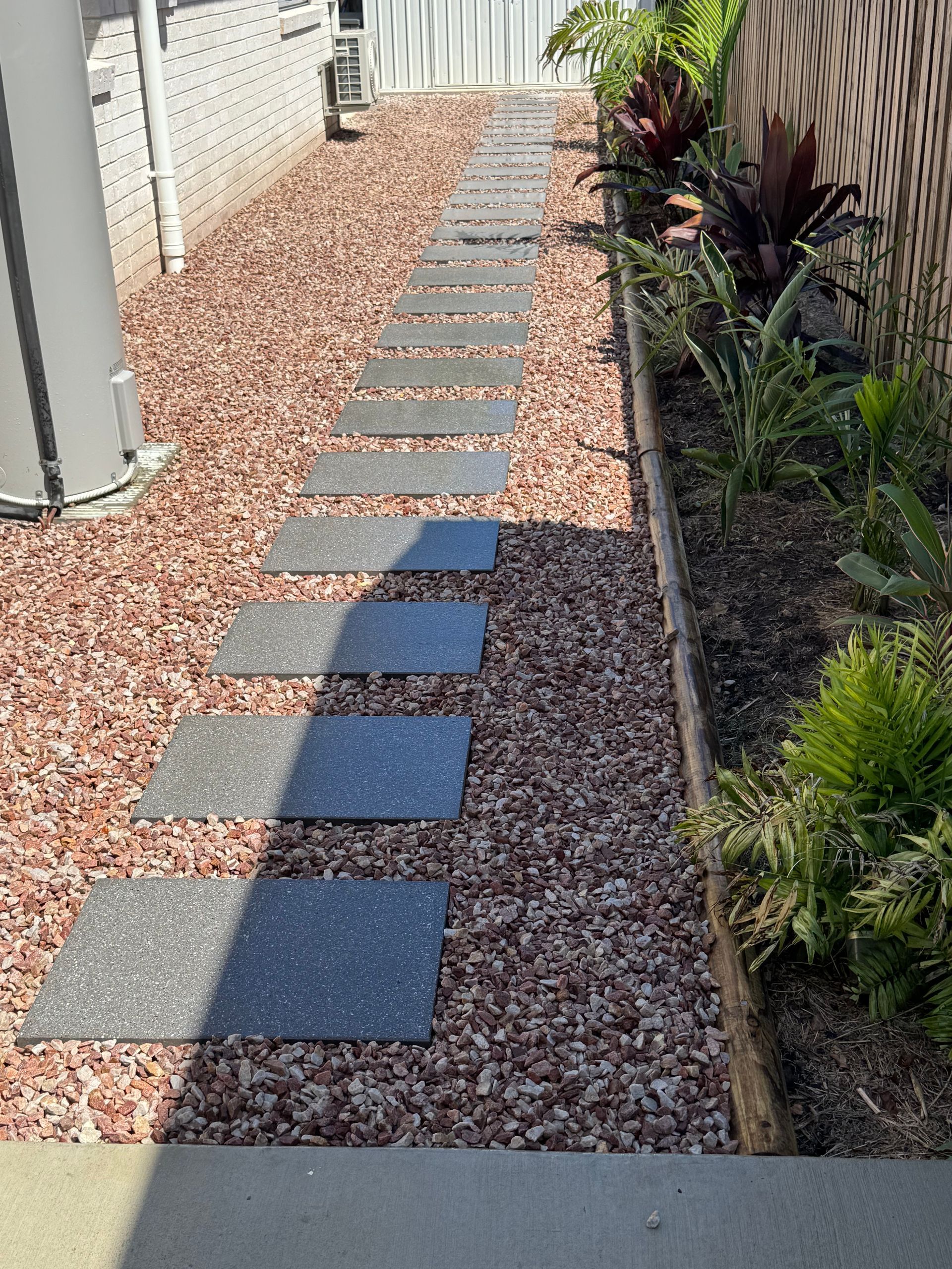 A Close Up of a Brick Floor With a Herringbone Pattern — Brendan's Landscaping and Fencing In Bundaberg, QLD