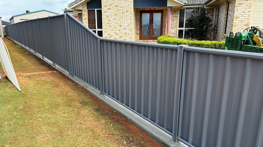 Gray Corrugated Steel Fence In Front Of A House
