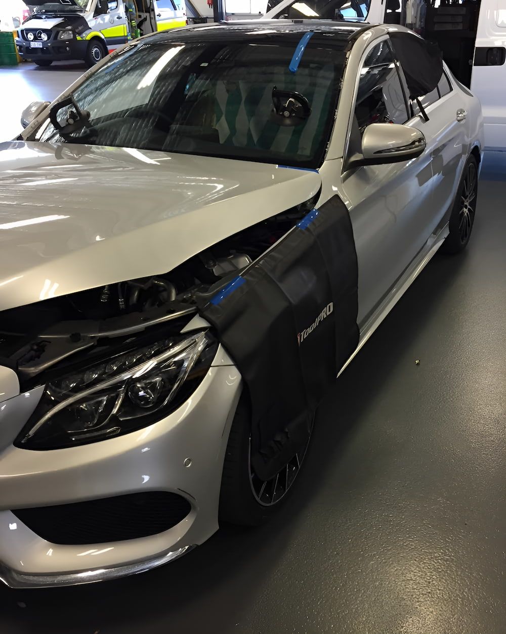 A Silver Car With The Hood Open Is Parked In A Garage — Canberra Windscreens In Conder, ACT