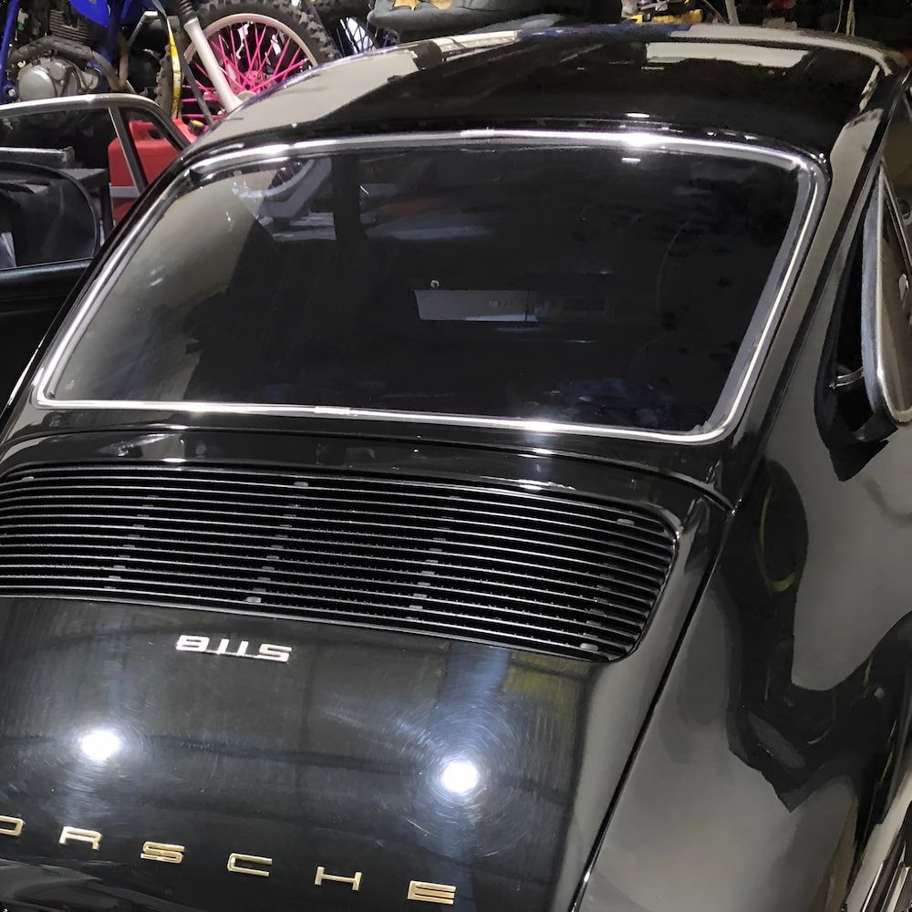 A Black Porsche Is Parked In A Garage — Canberra Windscreens In Woden, ACT