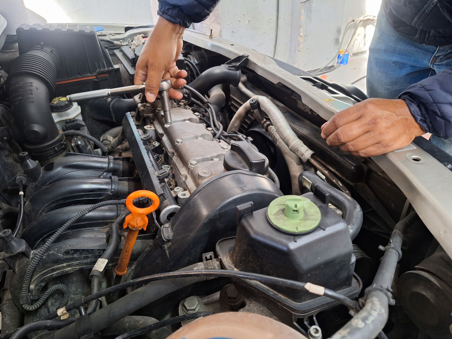 A man closing the engine of a car A man closing the engine of a car
