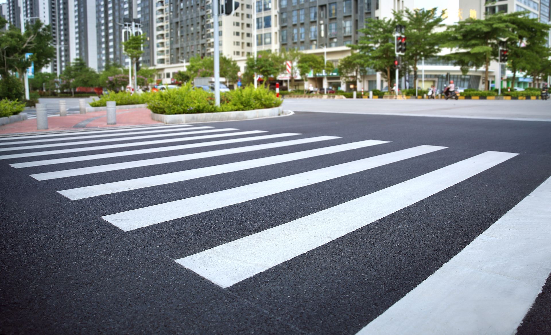 A zebra crossing in the middle of a city street.