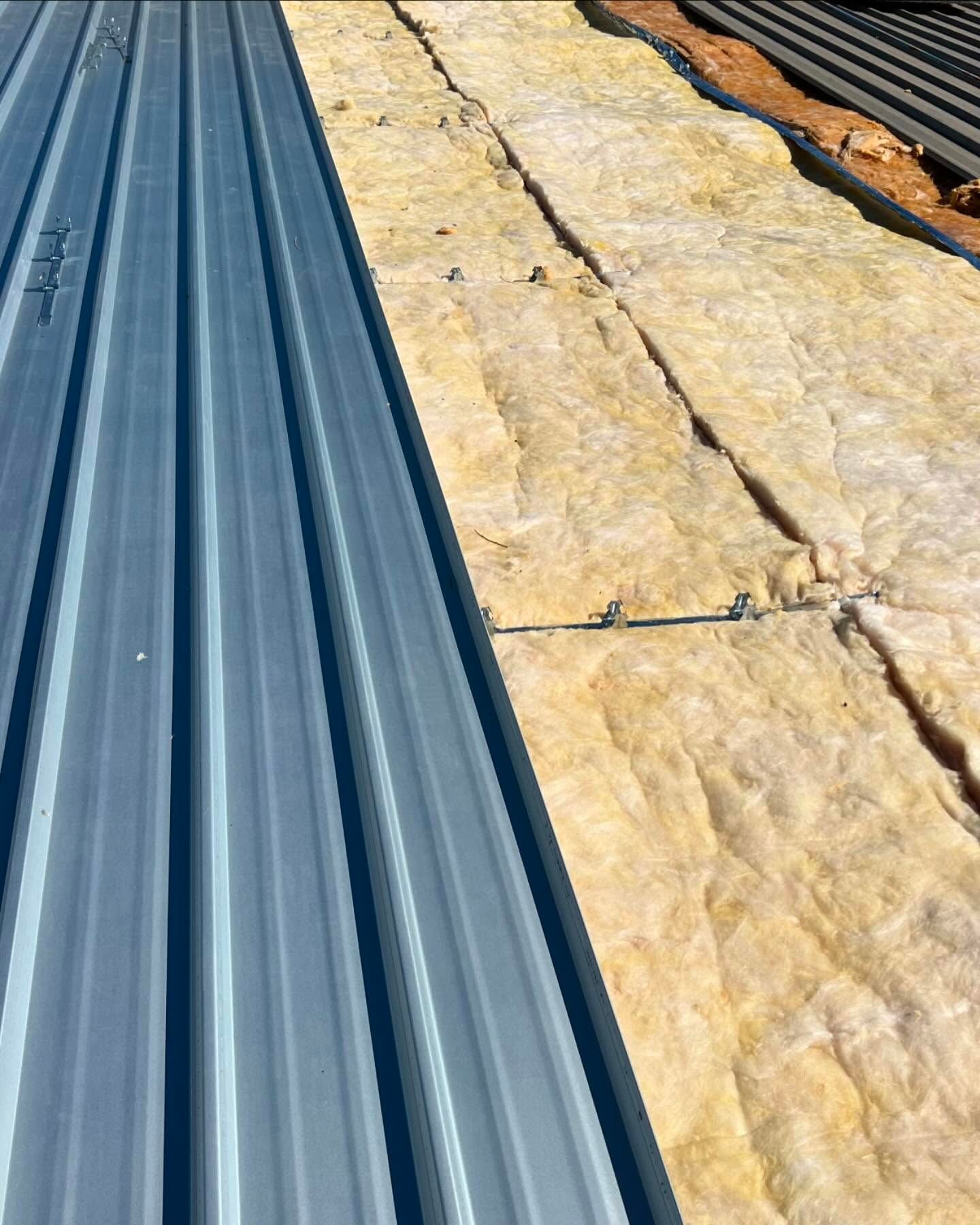 Metal Roof Panel Partially Installed Over Insulation — Ace Metal Roofing in Coffs Harbour, NSW