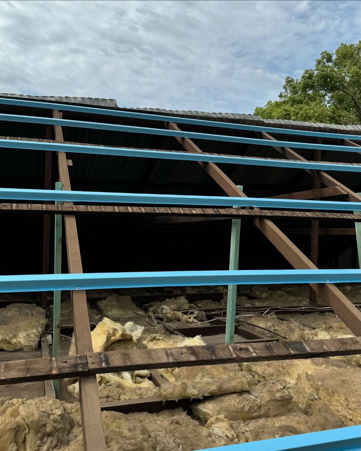 Roof Construction: Wooden Rafters With Blue Metal Supports — Ace Metal Roofing in Waterview Heights, NSW