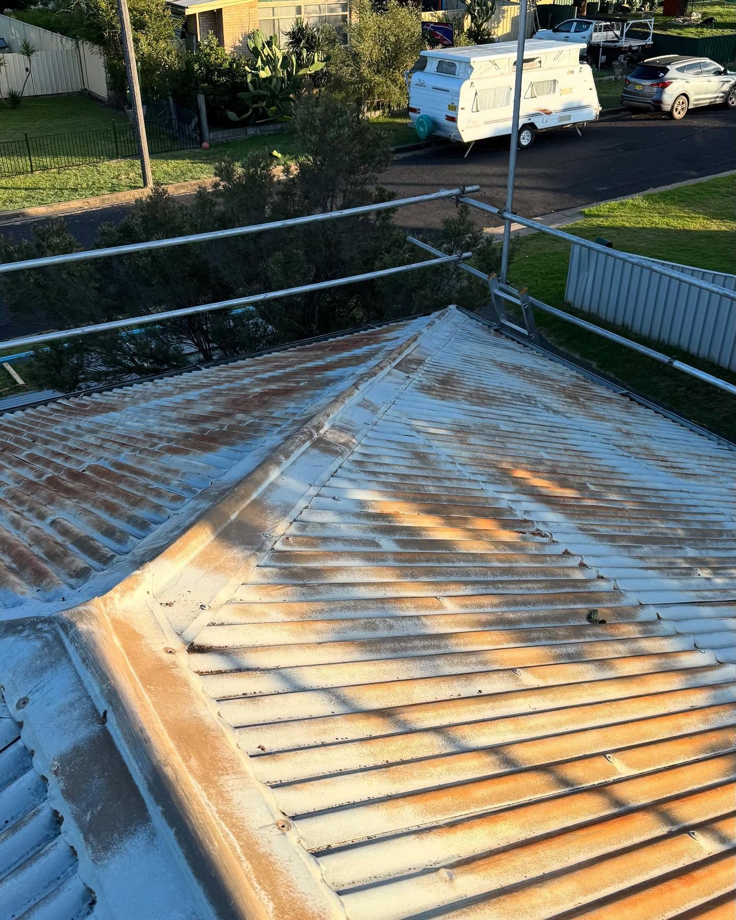 Rusty, Corrugated Metal Roof. Scaffolding Visible — Ace Metal Roofing in Waterview Heights, NSW